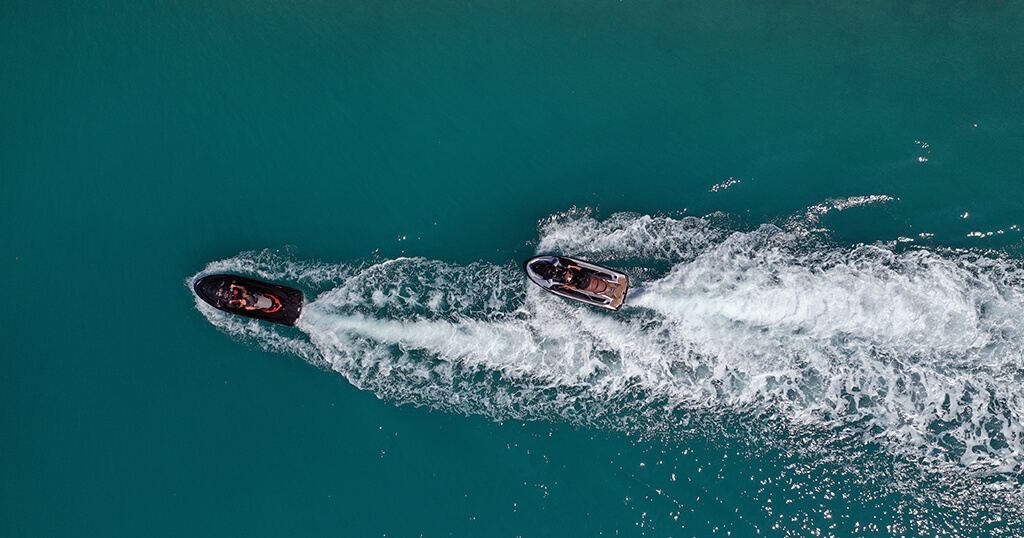 A bird's-eye view of two jet skis on the water